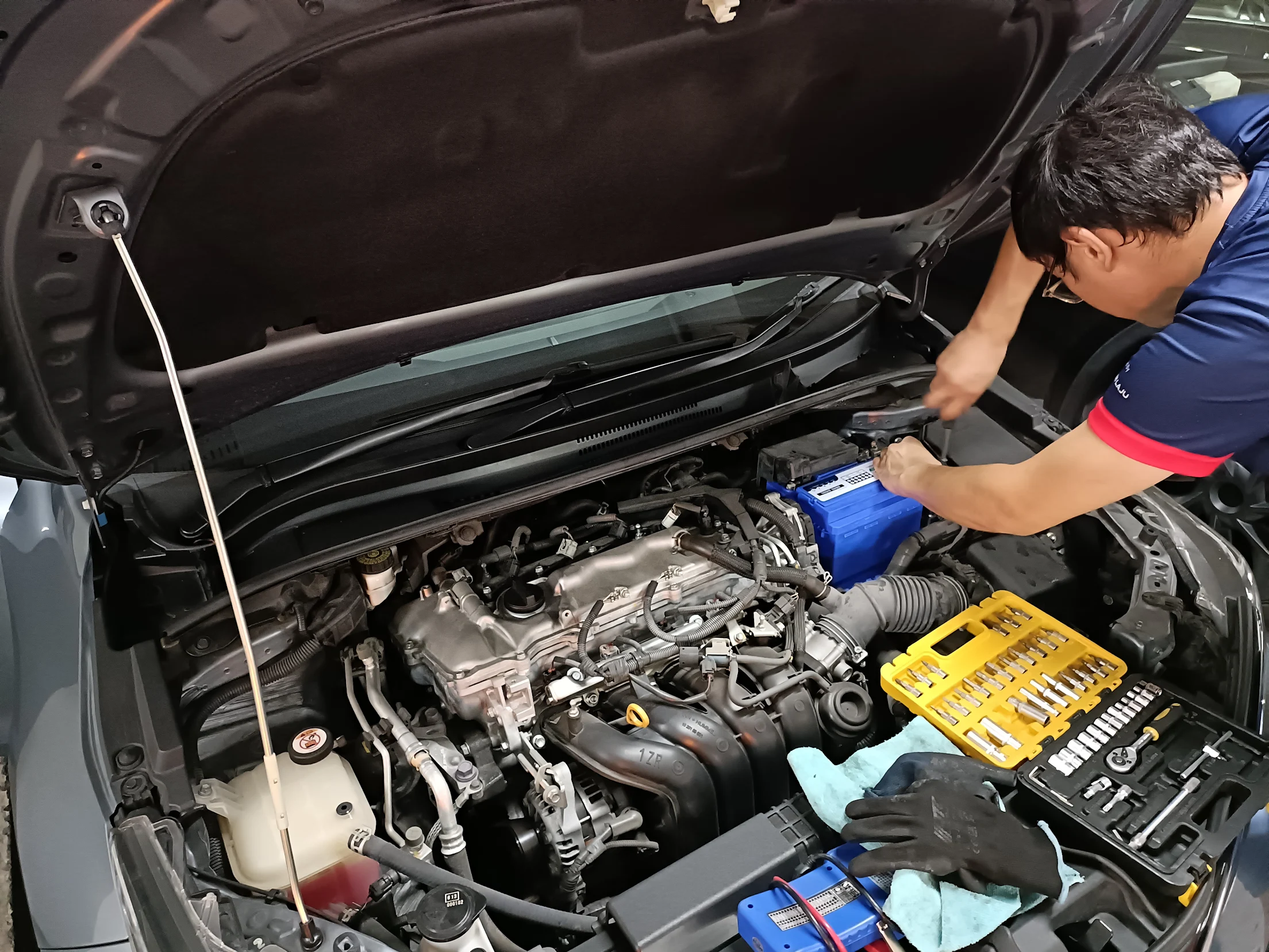 Technician at a car bonnet